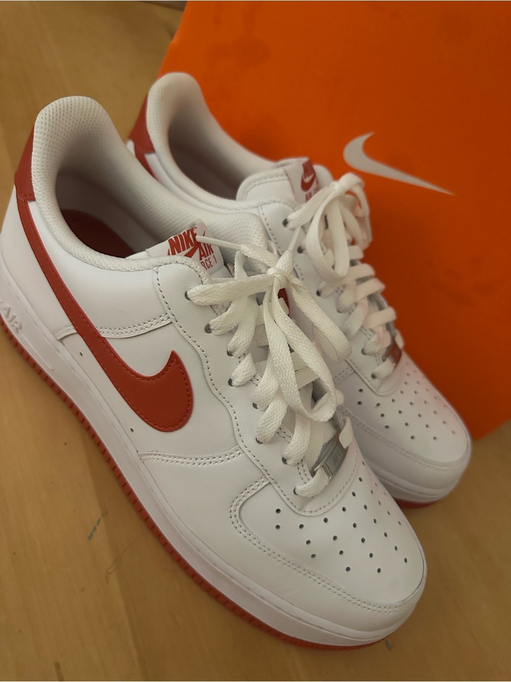 Nike White Low-Top Sneakers with Red Swoosh